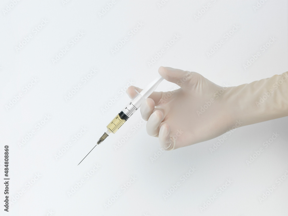 hand with syringe hand with syringe