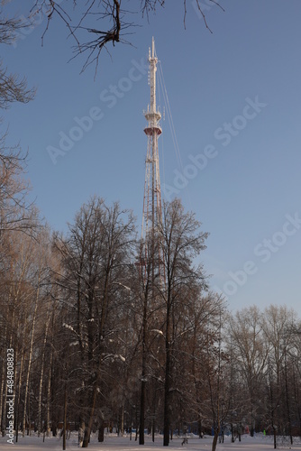 high TV tower on the background of blue sky