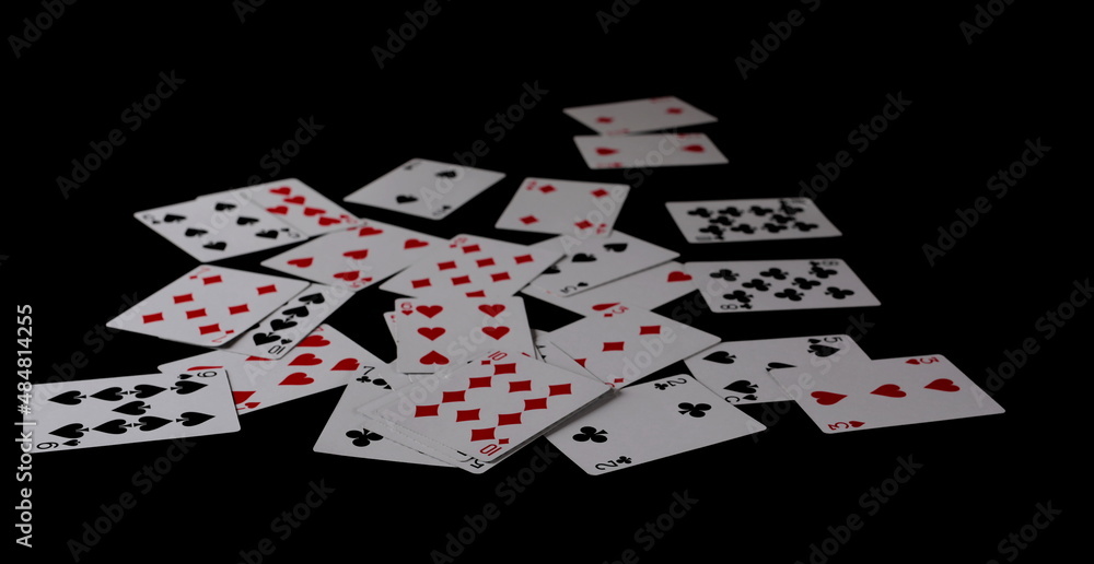 Playing cards for poker and gambling, isolated on black Playing cards for poker and gambling, isolated on black