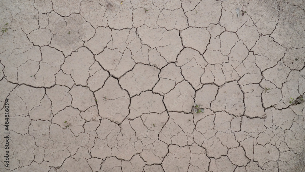 Cracked dry mud background in summer on the top view Cracked dry mud background in summer on the top view