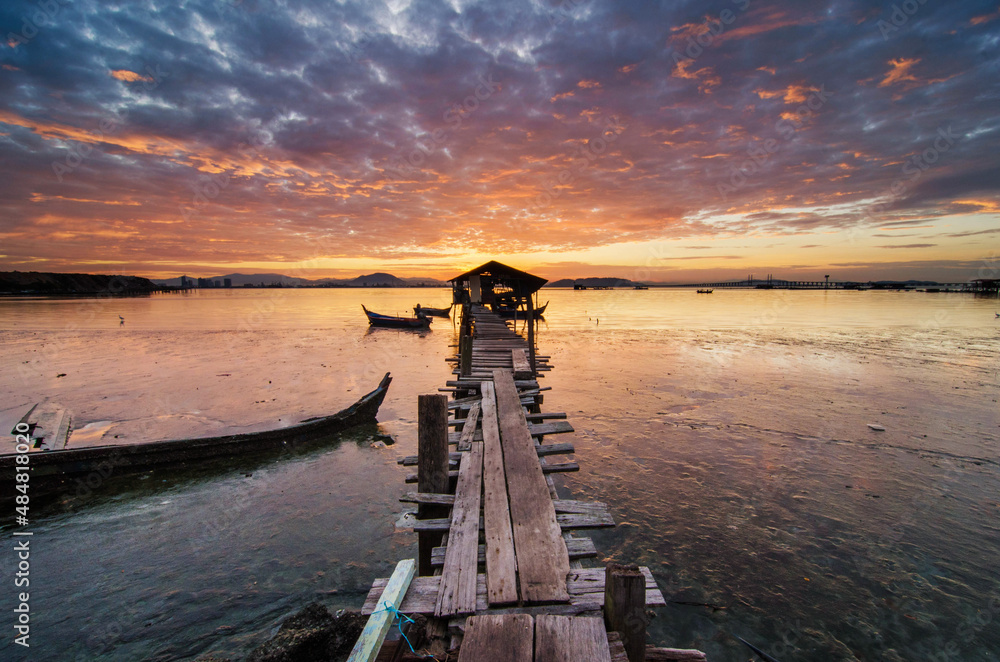 Morning scenery of a wooden jetty and hut 
