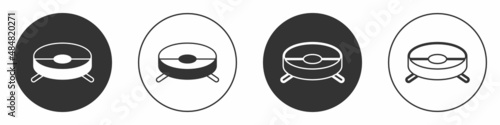 Black Robot vacuum cleaner icon isolated on white background. Home smart appliance for automatic vacuuming, digital device for house cleaning. Circle button. Vector