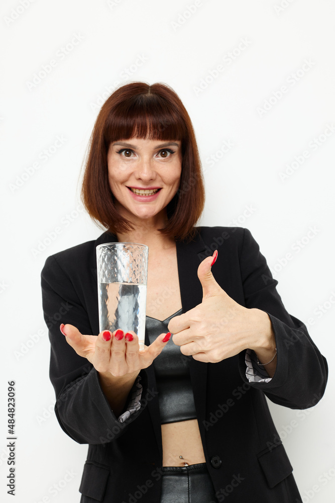 photo pretty woman black jacket transparent glass with water isolated background photo pretty woman black jacket transparent glass with water isolated background