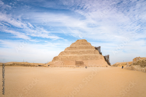 The Pyramids in Egypt under cloudy sky.