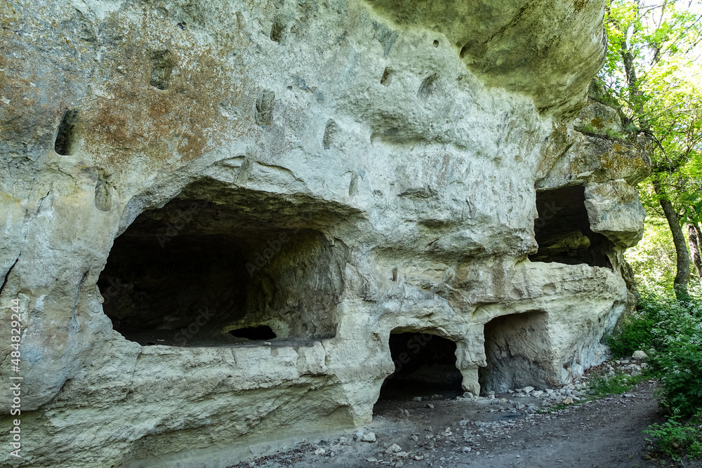 Caves of the city of Tepe-Kermen in Bakhchisarai. Crimea. Russia. Crimean mountains.