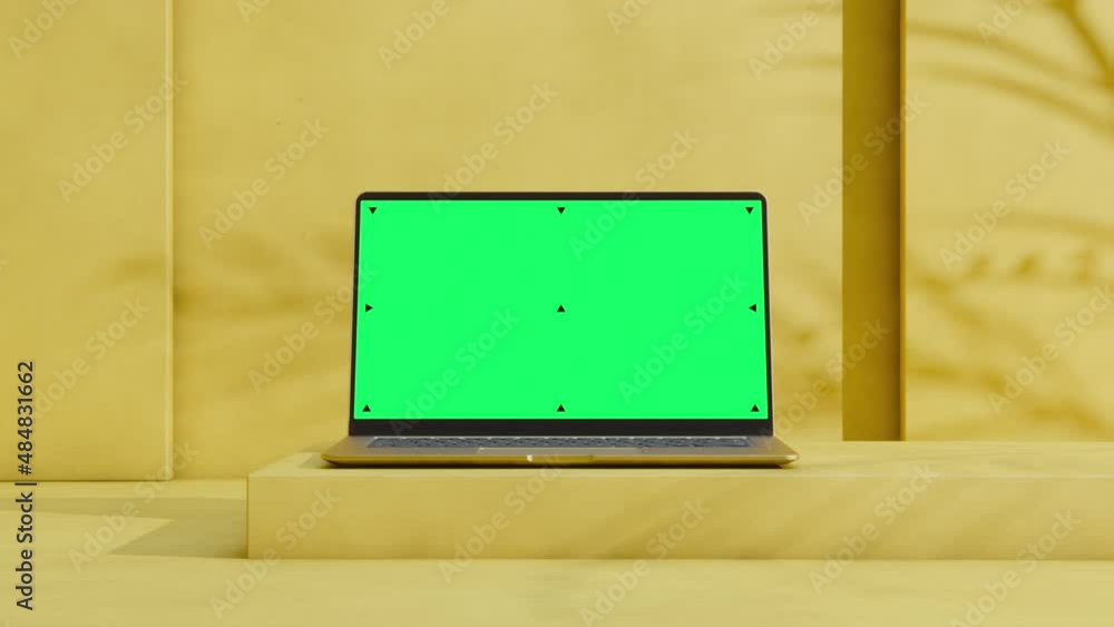 Mockup Shot of Laptop Computer with Green Screen in Bright, Cozy, Sunlit Environment with Rose Color Plaster Walls. 3D Animation. Screen has Tracking Markers Mockup Shot of Laptop Computer with Green Screen in Bright, Cozy, Sunlit Environment with Rose Color Plaster Walls. 3D Animation. Screen has Tracking Markers