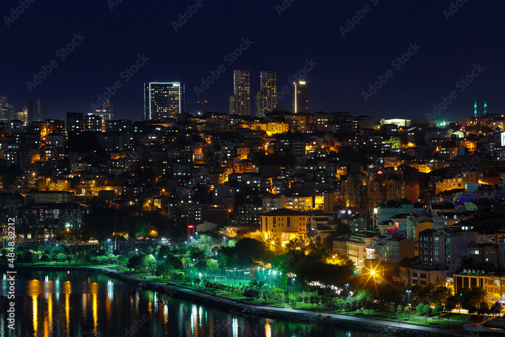 View of the sea bay Golden Horn, the city at the night, skyscrapers. The lights on in the houses. Journey to istanbul