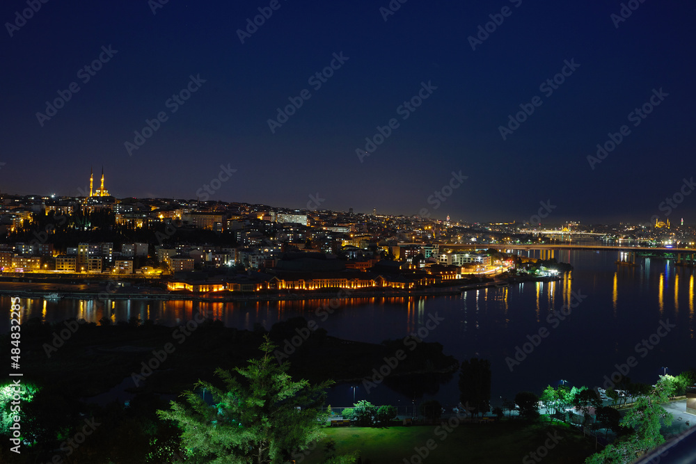 View of the sea bay Golden Horn, the city at night, in the houses with the lights on. Journey to istanbul