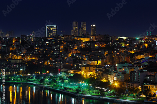View of the sea bay Golden Horn  the city at the night  skyscrapers. The lights on in the houses. Journey to istanbul