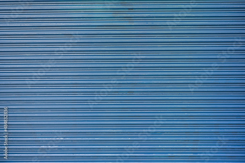 Abstract pattern blue metal fence background.