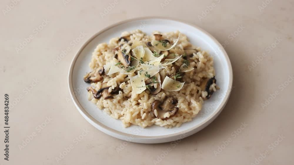 Risotto with mushrooms, cheese and thyme. Vegetarian food. Italian food. Risotto with mushrooms, cheese and thyme. Vegetarian food. Italian food.
