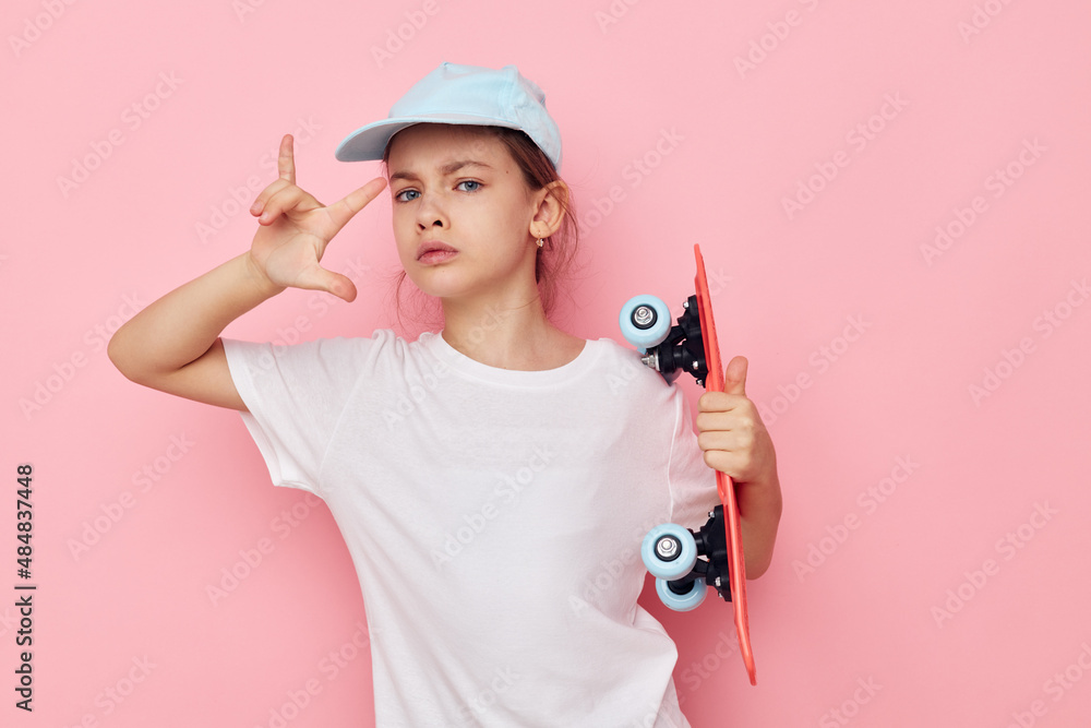 pretty young girl cap in white t-shirt skateboard Lifestyle unaltered pretty young girl cap in white t-shirt skateboard Lifestyle unaltered