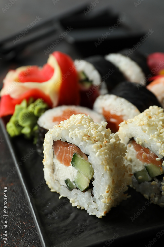 Concept of tasty food with sushi rolls, close up Concept of tasty food with sushi rolls, close up