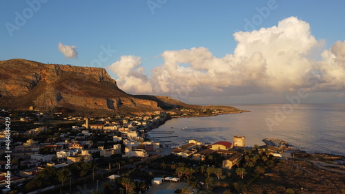Aerial landscape photography. Colorful morning cityscape of Bonagia town. Sunny spring seascape of Mediterranean sea. Picturesque scene of Sicily, Trapani Province, Europe.
