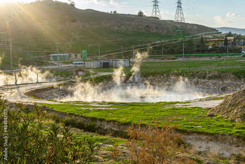 cenic views of thermal springs and mud bath in Sarayköy which contains bicarbonates and sulfates and power plant producing electricity from the geothermal steam, Denizli, Turkey photo