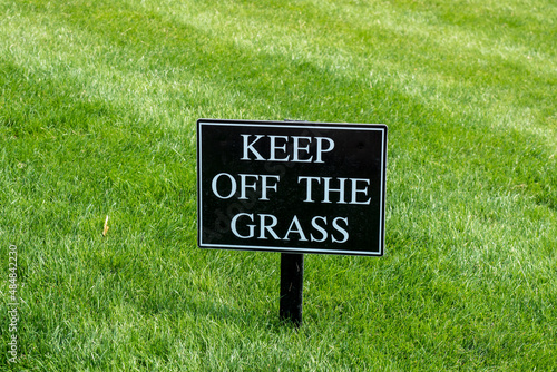 Принти на полотні Keep Off the Grass sign on a nicely kept lawn in a park