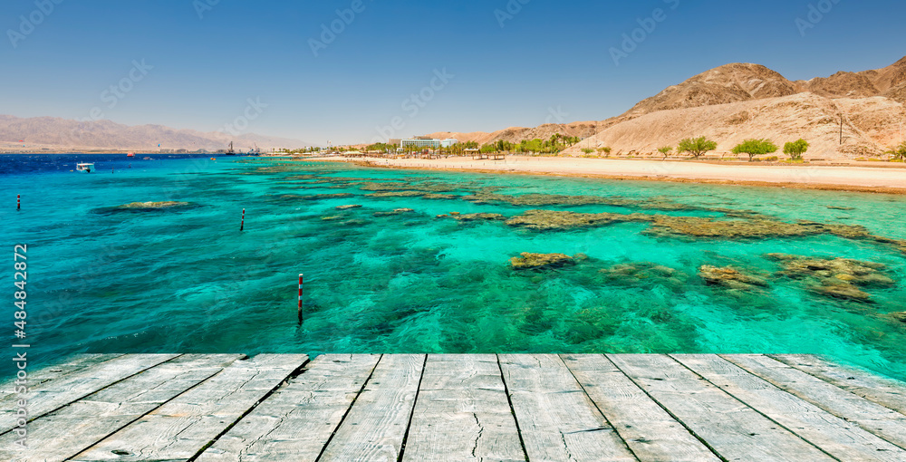 Seascape with coral reefs and wooden flooring as a copy space, Red Sea, nature reserve in vicinity of Eilat, Middle East