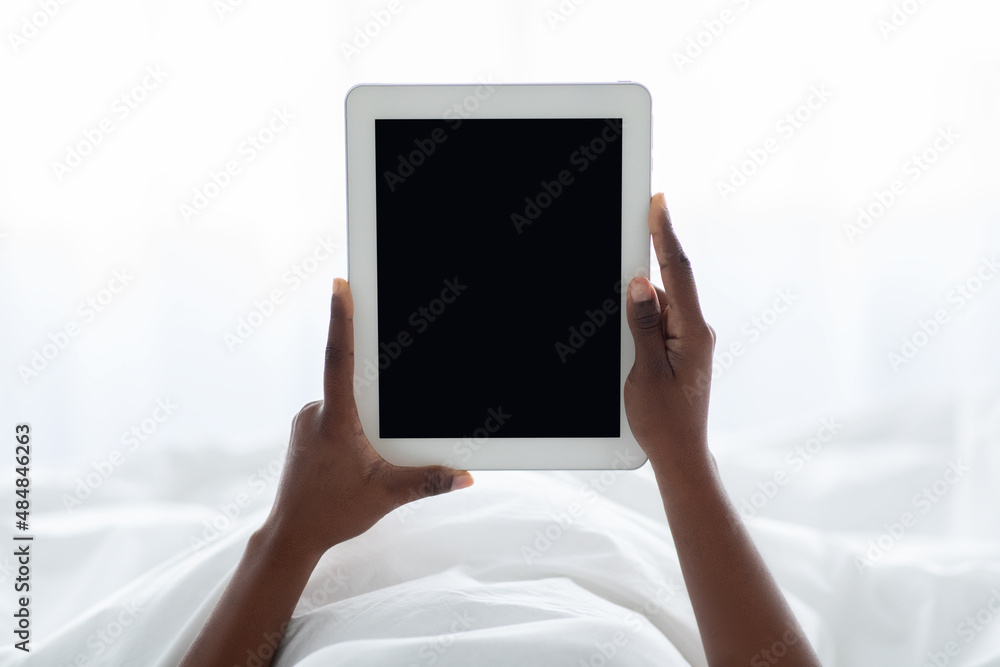 Female hands holding digital tablet with empty screen
