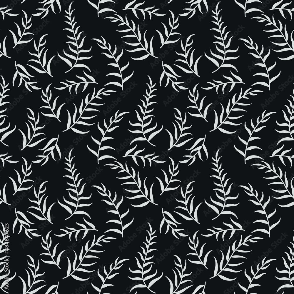 white tropical leaves on dark background 