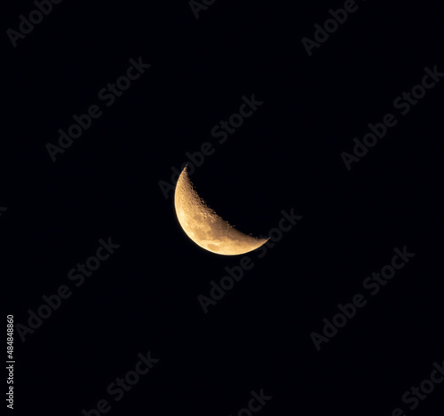 Image of crescent moon with dark sky background.