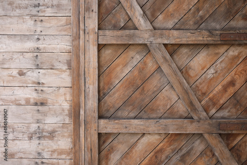 A close-up of a massive wooden door 