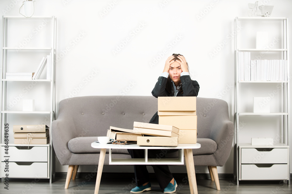 Upset business woman, unhappy secretary girl with folders with the documents working overtime at office. Problem solution. Upset business woman, unhappy secretary girl with folders with the documents working overtime at office. Problem solution.