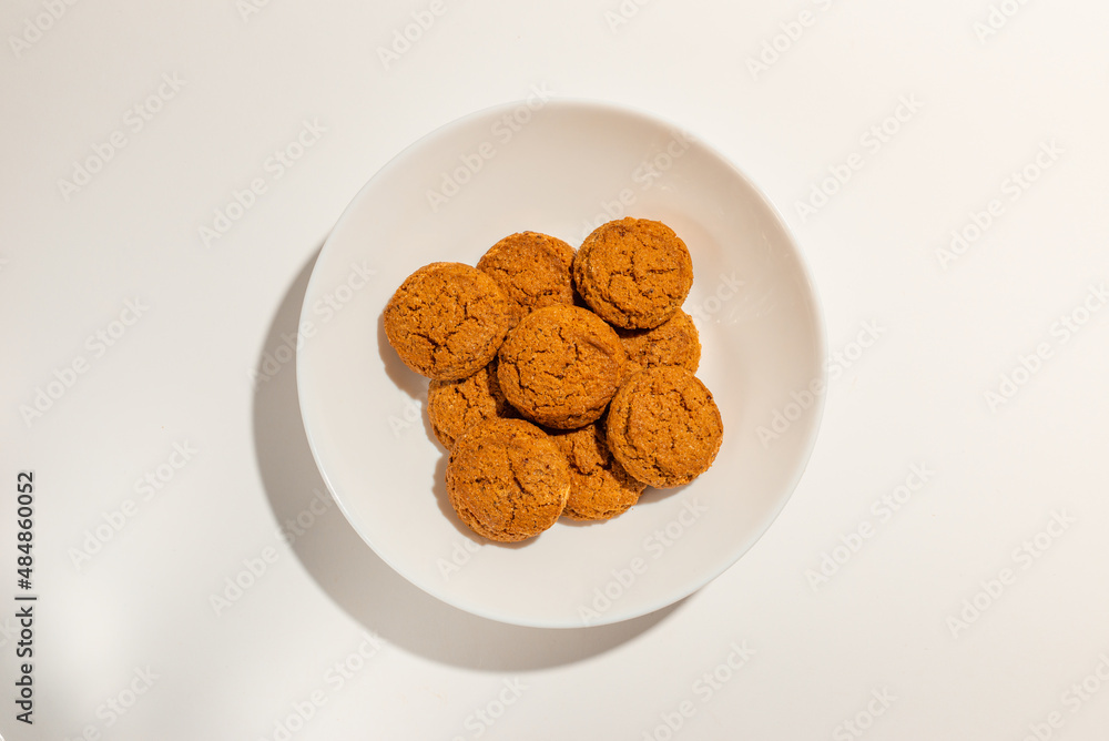 Cookies,Biscuits on white plate top view on white background. Cookies,Biscuits on white plate top view on white background.