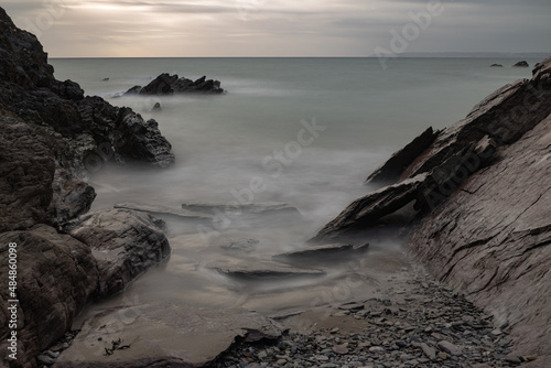 Long exposure of Freathy bay at sundown in Whitsand Bay Cornwall photo