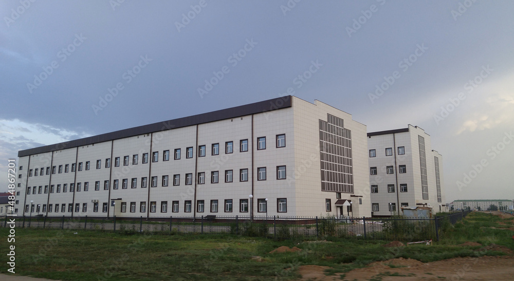 Uralsk, Kazakhstan (Qazaqstan), 31.07.2016 - General hospital in the city of Uralsk (Kazakhstan), building body, conventional design building with identical windows, rectangular structure Uralsk, Kazakhstan (Qazaqstan), 31.07.2016 - General hospital in the city of Uralsk (Kazakhstan), building body, conventional design building with identical windows, rectangular structure