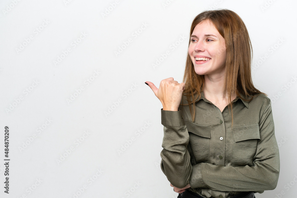 Young English woman isolated on white background pointing to the side to present a product Young English woman isolated on white background pointing to the side to present a product