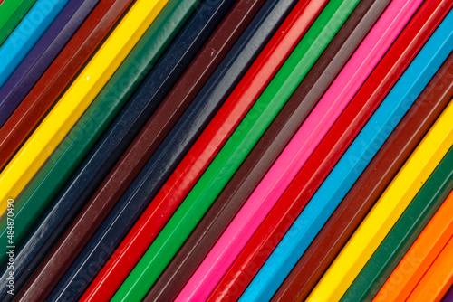 Colored pencils in the form of an abstract background. close-up.