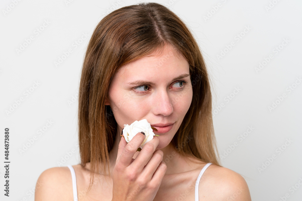 Young English woman holding flowers. Close up portrait