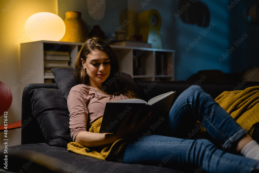 woman reading book at home woman reading book at home