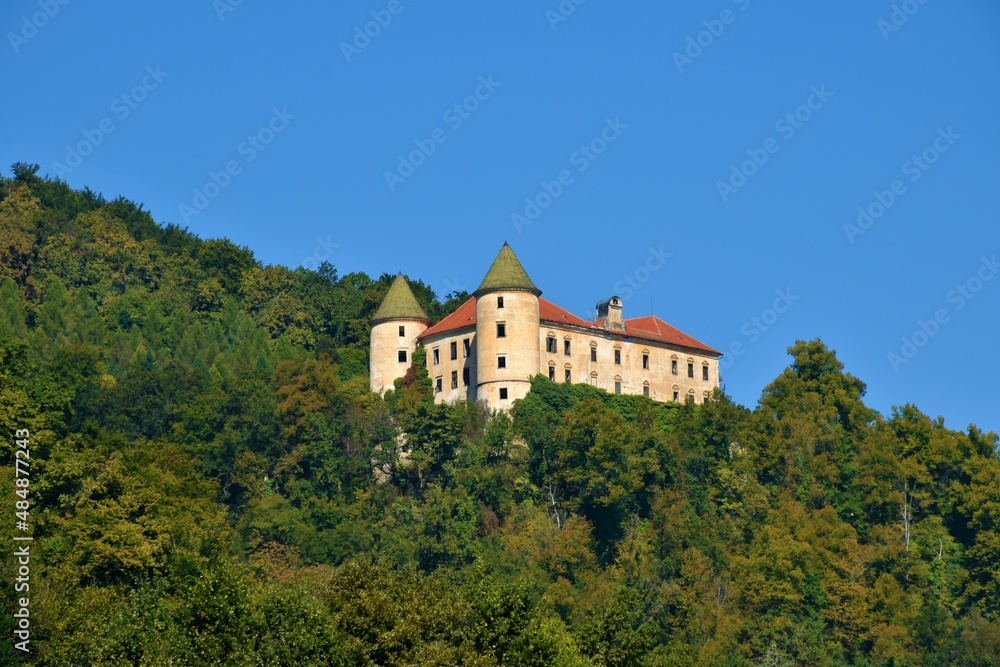 View of Podcetrtek castle surrounded by a forest in Stajerska, Slovenia