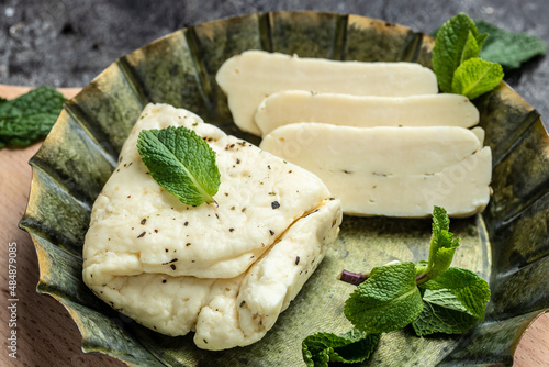 Traditional slices of cyprus halloumi cheese with mint. healthy eco food. Food recipe background. Close up photo