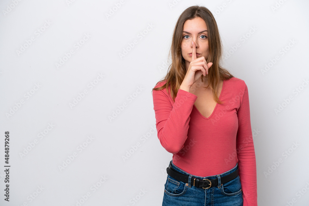 Young caucasian woman isolated on white background showing a sign of silence gesture putting finger in mouth Young caucasian woman isolated on white background showing a sign of silence gesture putting finger in mouth
