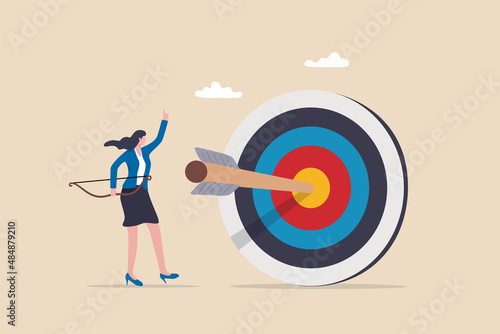 Achieve target, reach goal or success female entrepreneur, aiming to hit bullseye target concept, cheerful businesswoman archery shot arrow to hit big target.