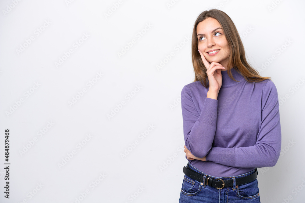 Young caucasian woman isolated on white background thinking an idea while looking up Young caucasian woman isolated on white background thinking an idea while looking up
