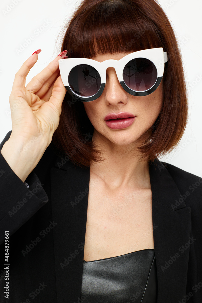 photo pretty woman in a black suit sunglasses luxury isolated background photo pretty woman in a black suit sunglasses luxury isolated background