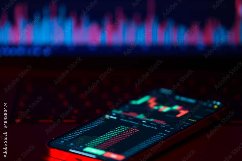 Cryptocurrency market is going down, is time to sell, red candles. The graph evolution of Bitcoin on a laptop and smartphone display showing the prices falling. Cryptocurrency market is going down, is time to sell, red candles. The graph evolution of Bitcoin on a laptop and smartphone display showing the prices falling.