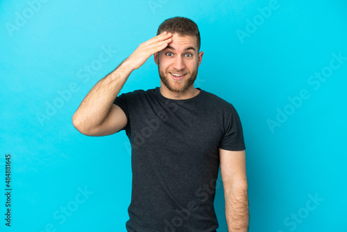 Young handsome caucasian man isolated on blue background has realized something and intending the solution