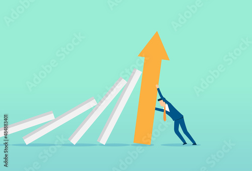 Businessman stop the domino effect, falling down, business bankruptcy or crisis, risk and finding solution metaphor