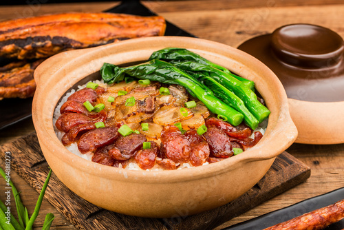 Photos Cantonese style cooking of claypot rice with waxed meats