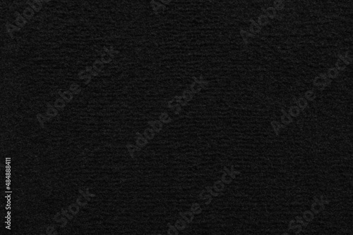 Texture of black car floor carpet as background, top view