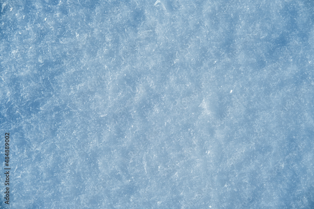 Fresh snow background texture. Winter background with big beautiful snowflakes.