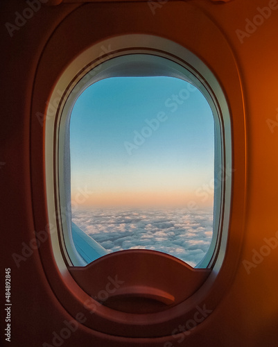 Airplane window at dawn