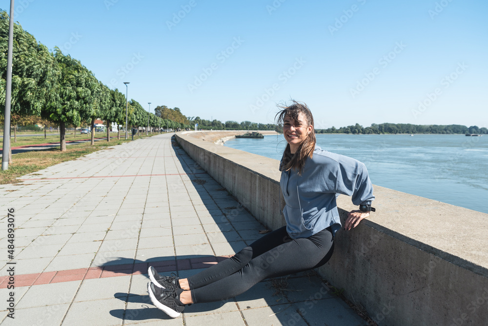 Young active sporty business woman morning routine of exercising outdoor before she go to the work at office. Self loved female workout training for healthy life. Young active sporty business woman morning routine of exercising outdoor before she go to the work at office. Self loved female workout training for healthy life.