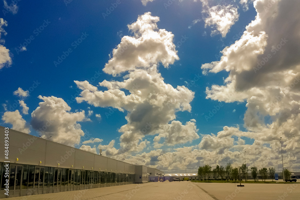 beautiful huge clouds above the entrance group of the stadium in the city of Kaliningrad