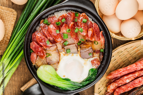 Cantonese style cooking of claypot rice with waxed meats