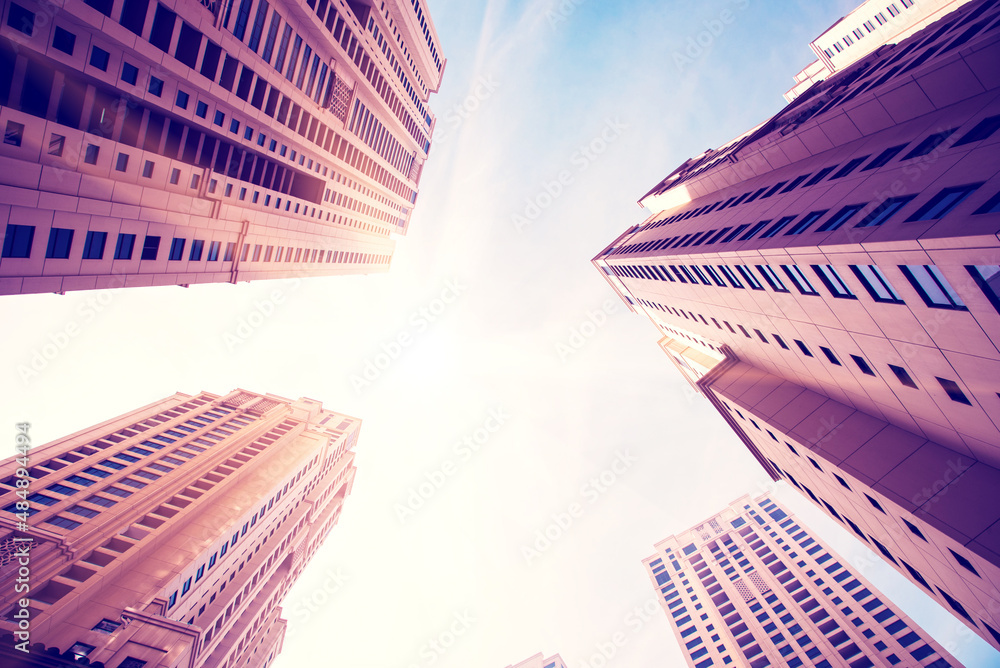 Abstract architectural image with skyscrapers on sky background.
